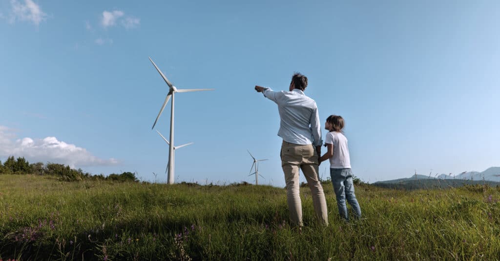 Landscape image for blog post with wind turbine and blue sky